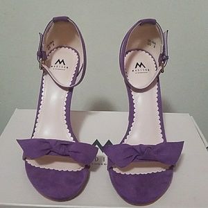 Purple suede stilettos w/front bow-tie. Never worn